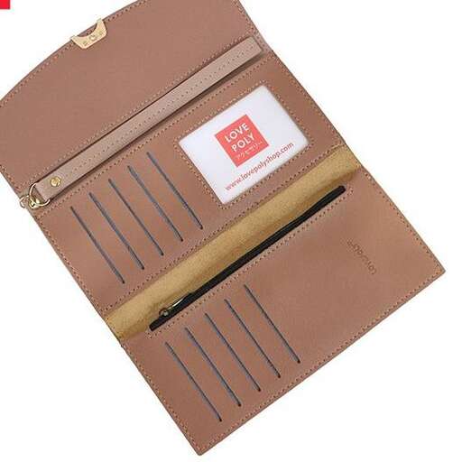 the box is made of brown leather and has a sticker on the front.