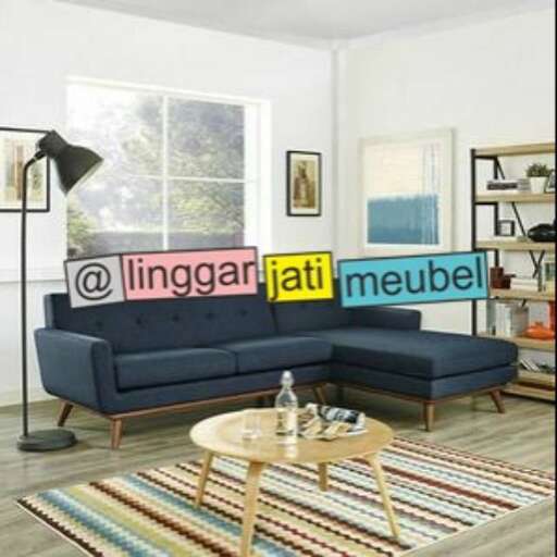 a living room with a blue couch and a coffee table.