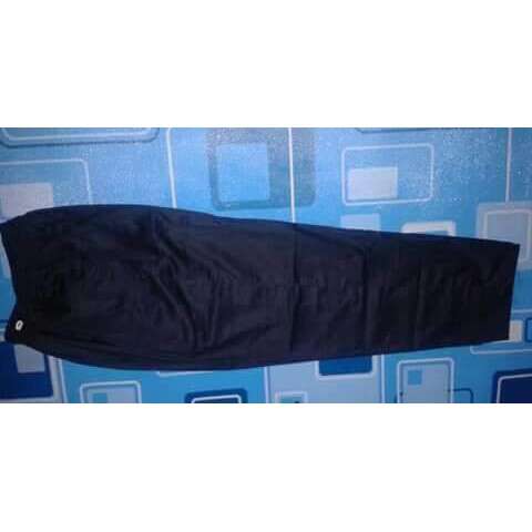 a black bag laying on a blue and white wall.