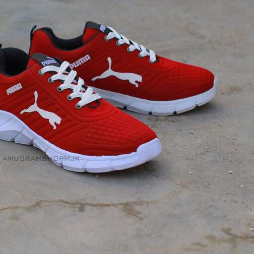a pair of red and white sneakers