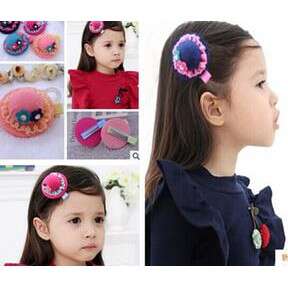 a little girl with a flower in her hair