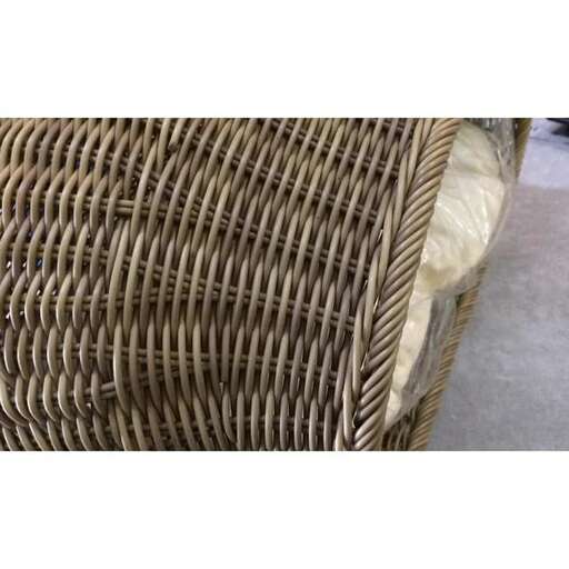 a wicker basket made from a woven fabric.