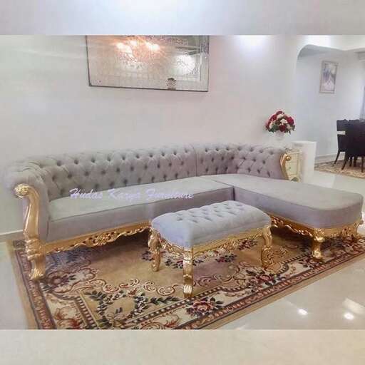 a living room with a couch, chair, table and a piano.