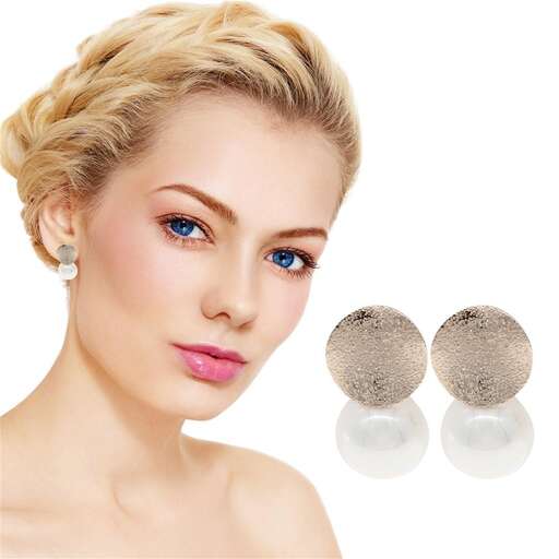 the face of a young woman with a round face and round earrings