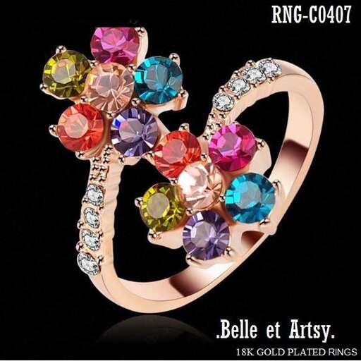 a ring with a pink sapphire and diamond.