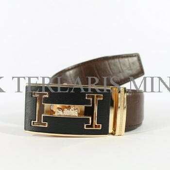 leather belt with a gold buckle