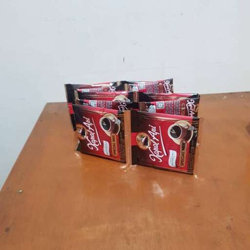 a table with a couple of cans of coca cola.