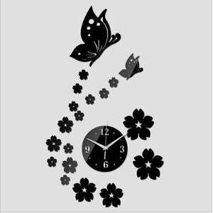 a clock with flowers and butterflies.