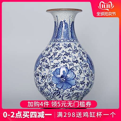 a blue and white vase with a flower on it