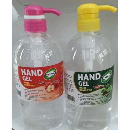 a bottle of water with a yellow cap and a pink top.