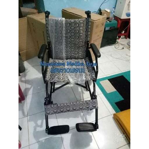 a chair with a cushion sitting on top of it.