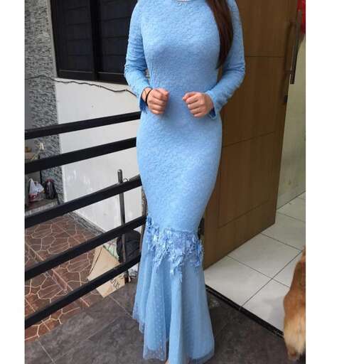 actor in a long blue dress
