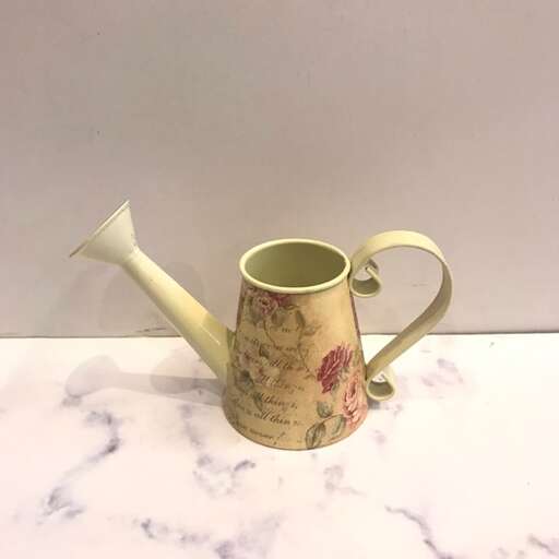 a teapot with a handle on a table
