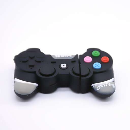 a black and white video game controller with a white background.