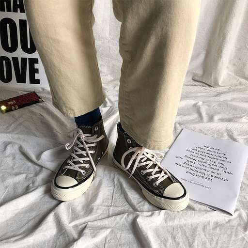 person, a pair of shoes, with a message.