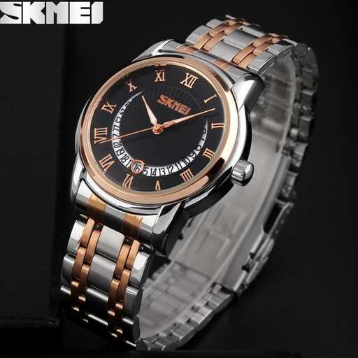 a watch with a gold band on it.