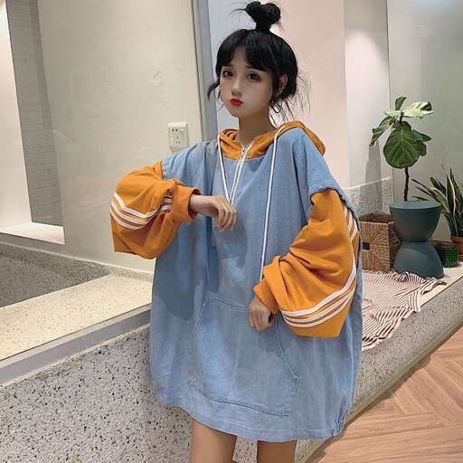 a girl in a blue dress and a white shirt