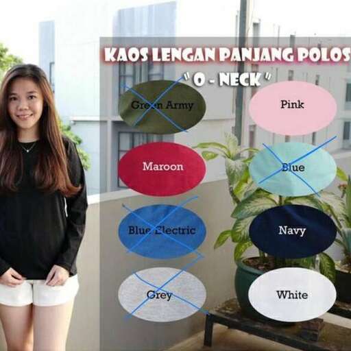 a girl in white shorts and black top standing next to a plant.