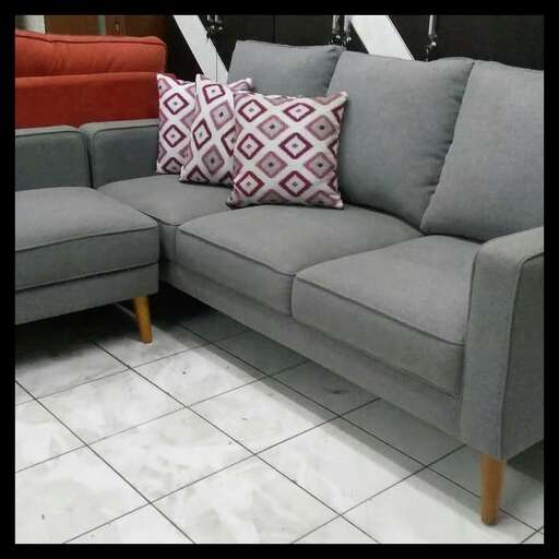 a couch with a cushion and a cushion.