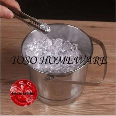 a person is holding a spoon in a cup of ice.