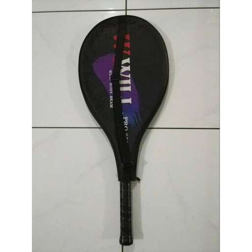 a black tennis racket with a blue and purple design.