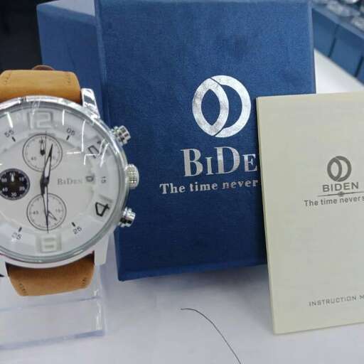 a watch on a table with a blue case.
