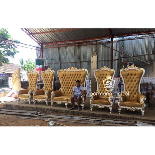 a man sitting on a chair in a shop