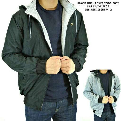 a boy in a grey jacket