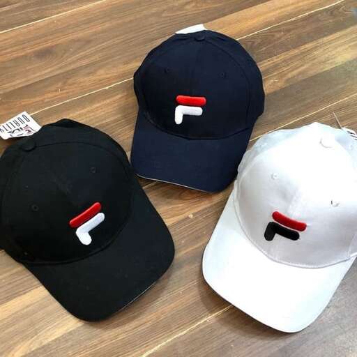 a couple of hats are on a wooden table.