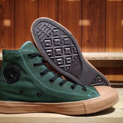 a pair of green canvas shoes