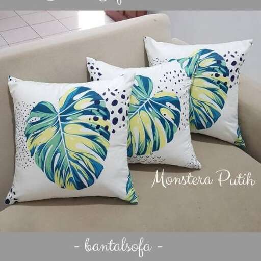 a pillow with a tropical print.