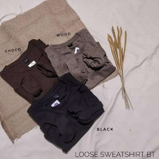 a shirt with a lot of clothes on it