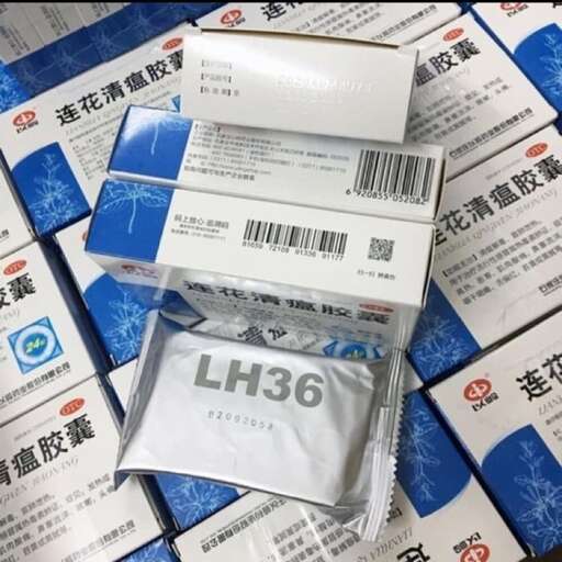 a package of cigarettes, with a packet of cigarettes in the background.