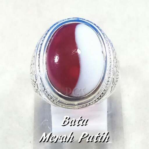 a red glass bead made from a sterling silver plated ring.