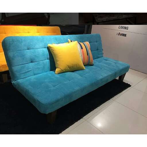 a blue sofa with yellow cushions.