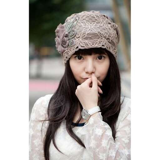 a girl with a hat on her head