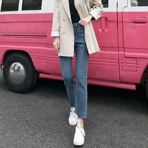 person in a blazer and jeans