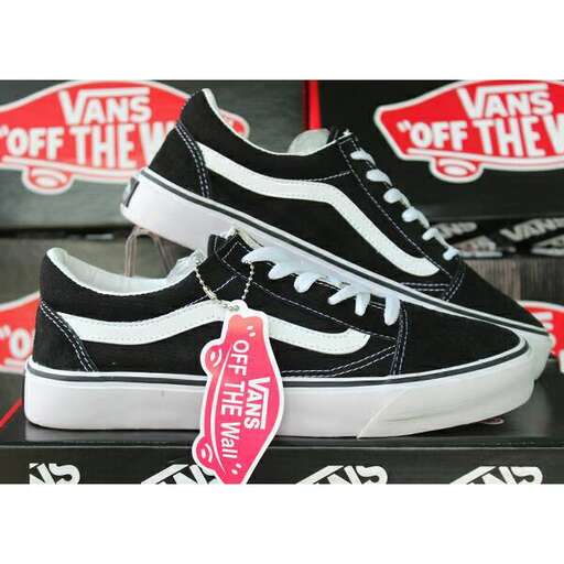 a pair of black and white sneakers