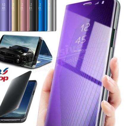 a person holding a cell phone with a purple background