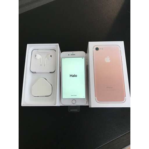 a couple of cell phones sitting on top of a table.
