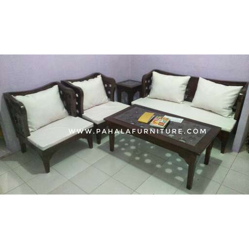 a pair of chairs with cushions and a coffee table.