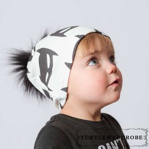 a child with a headband on his head.