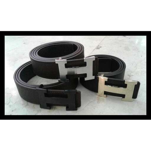 a pair of black leather belts with a white handle.