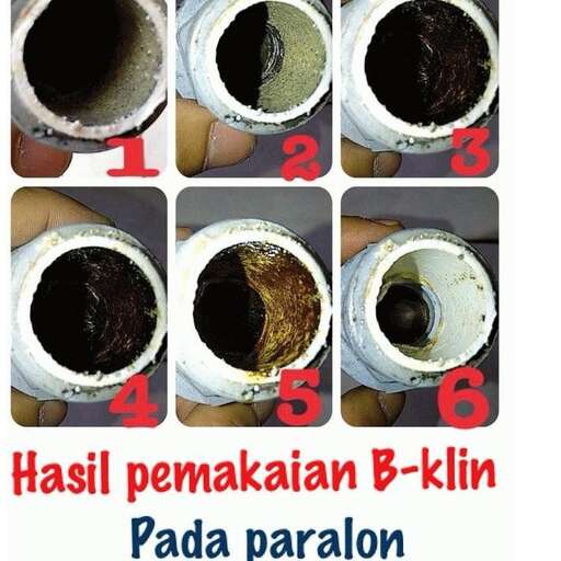 a person holding a cup with black stuff in it.