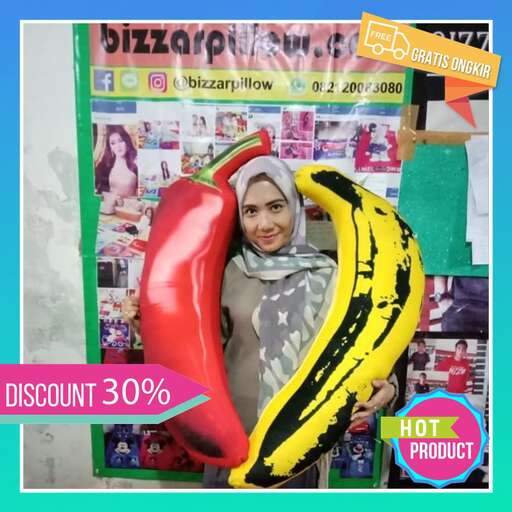 a woman in a scarf and scarf holding a hot dog.