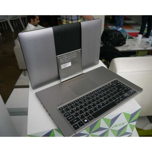 a laptop computer sitting on top of a table.