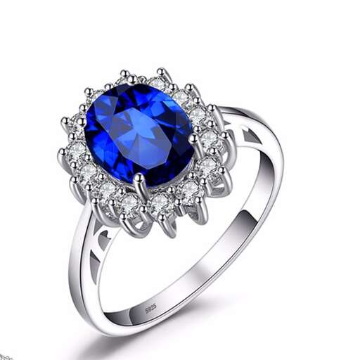 a ring with a sapphire and diamonds.