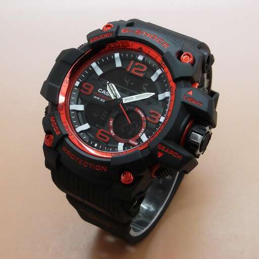 the watch is made of black leather and red leather.