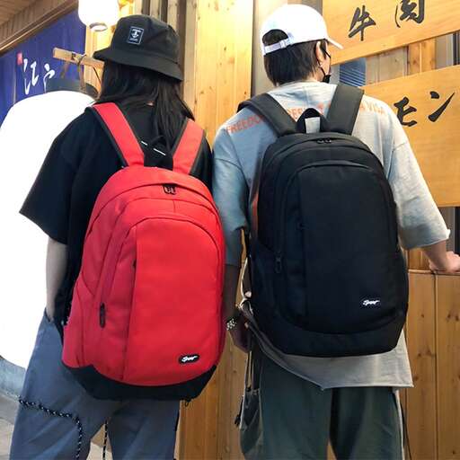 a couple of people with backpacks standing next to each other.