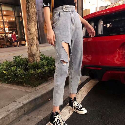 person in a black t - shirt and jeans